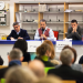 Plusieurs personnalités politiques dont Jacques Bahi au micro devant un public dans la BU sciences et sport.